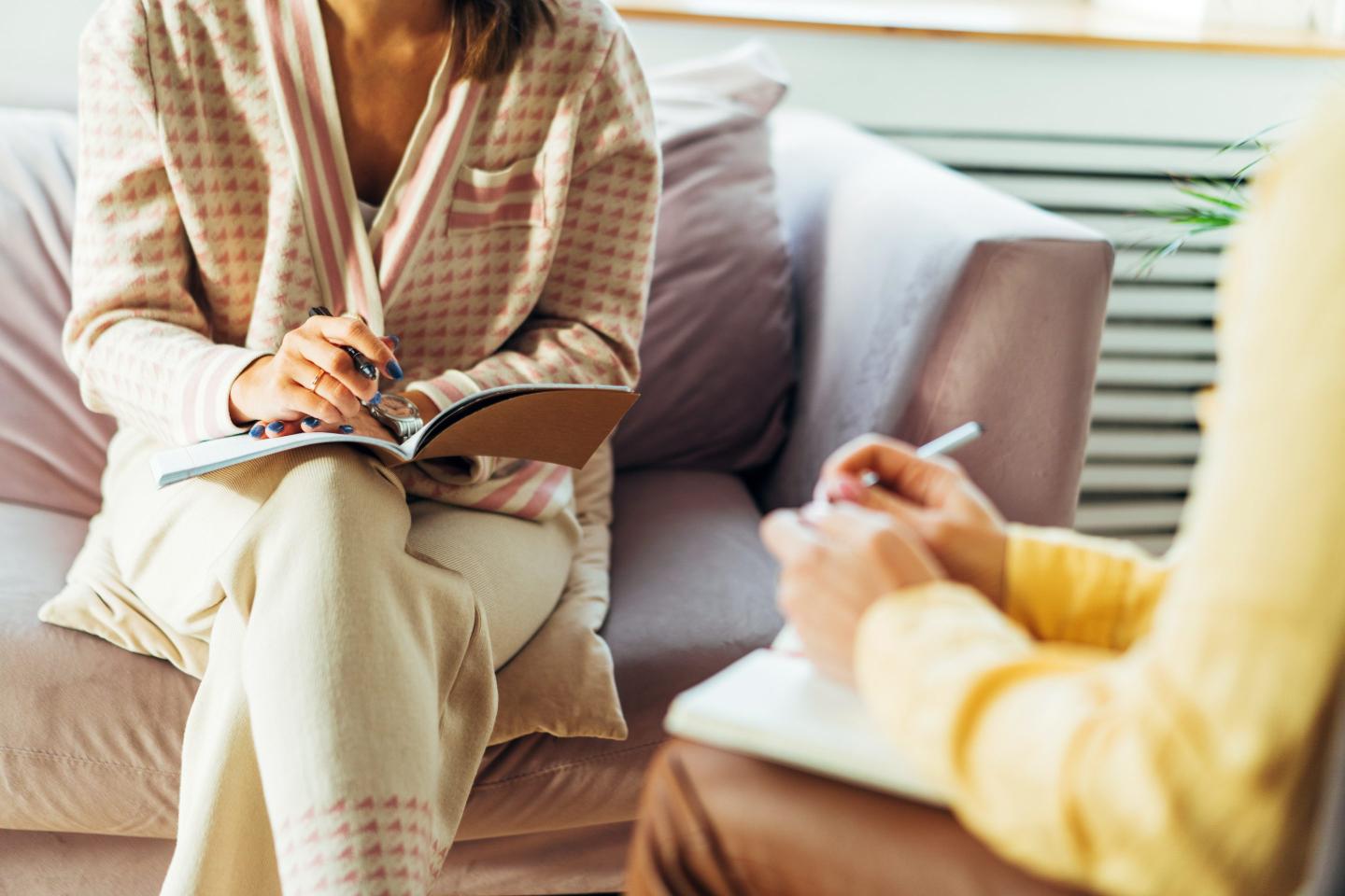 Two people sitting during an interview.