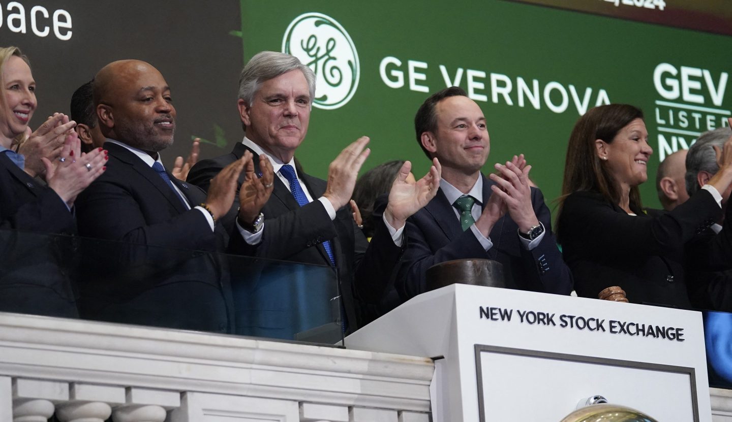 GE Vernova CEO Scott Strazik and others from the GE family celebrate the New York Stock Exchange listing by ringing the bell and applauding.