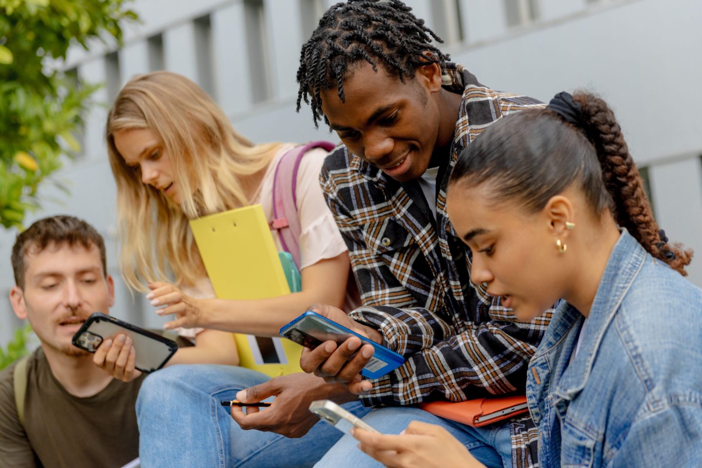 Group of students all on their phones