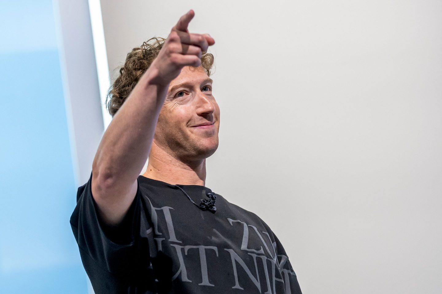 Mark Zuckerberg, CEO of Meta, points on stage