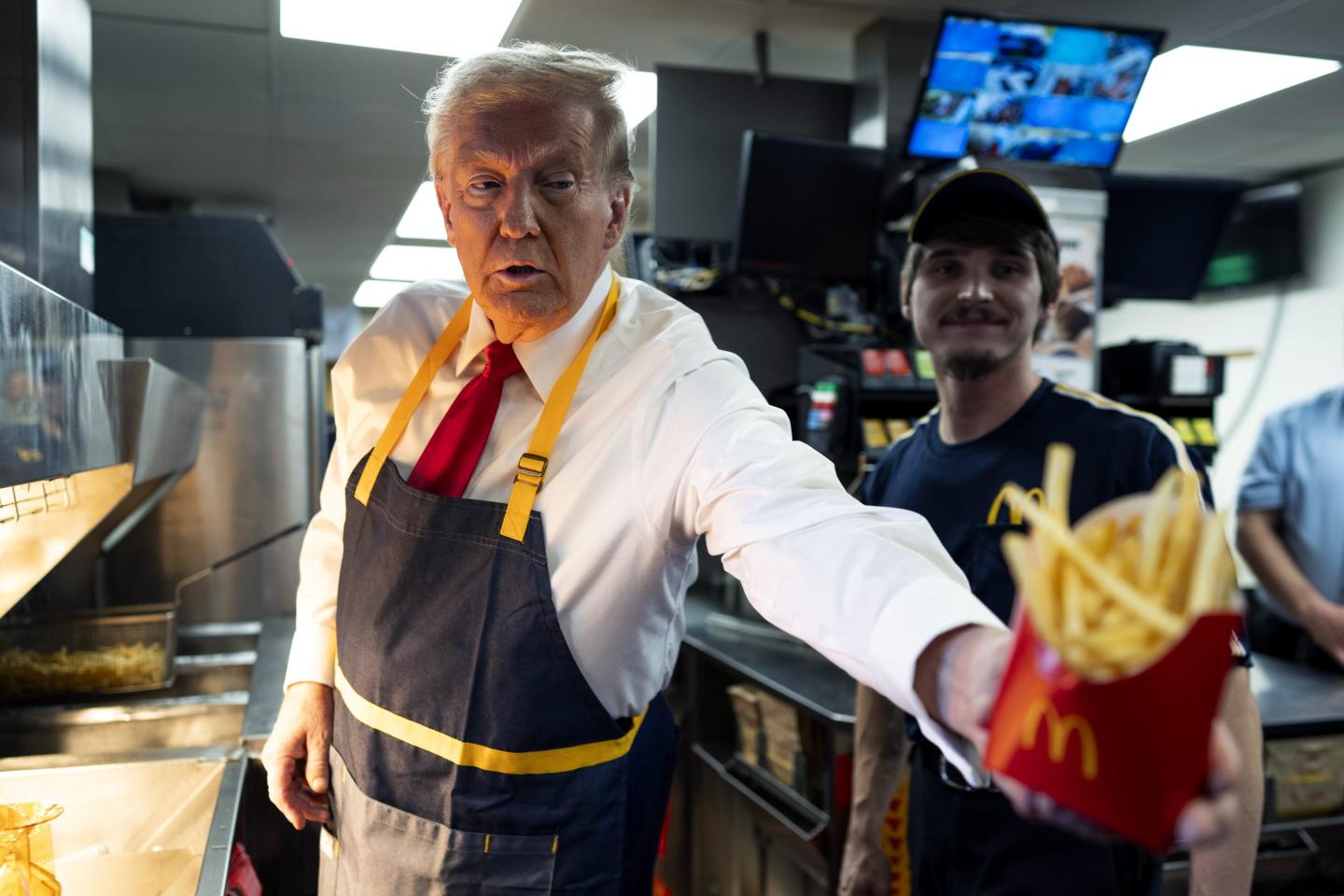 Photo: FEASTERVILLE-TREVOSE, PENNSYLVANIA - OCTOBER 20: Republican presidential nominee, former U.S. President Donald Trump works behind the counter during a campaign event at McDonald's restaurant on October 20, 2024 in Feasterville-Trevose, Pennsylvania. Trump is campaigning the entire day in the state of Pennsylvania. Trump and Democratic presidential nominee Vice President Kamala Harris continue to campaign in battleground swing states ahead of the November 5th election. (Photo by Doug Mills-Pool/Getty Images)