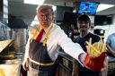 Photo: FEASTERVILLE-TREVOSE, PENNSYLVANIA - OCTOBER 20: Republican presidential nominee, former U.S. President Donald Trump works behind the counter during a campaign event at McDonald's restaurant on October 20, 2024 in Feasterville-Trevose, Pennsylvania. Trump is campaigning the entire day in the state of Pennsylvania. Trump and Democratic presidential nominee Vice President Kamala Harris continue to campaign in battleground swing states ahead of the November 5th election. (Photo by Doug Mills-Pool/Getty Images)