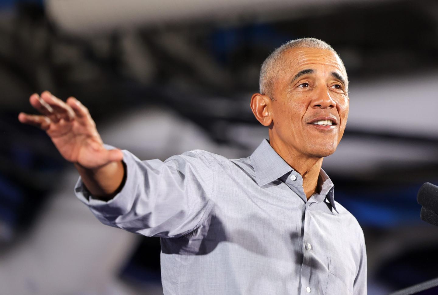 Former President Barack Obama gestures