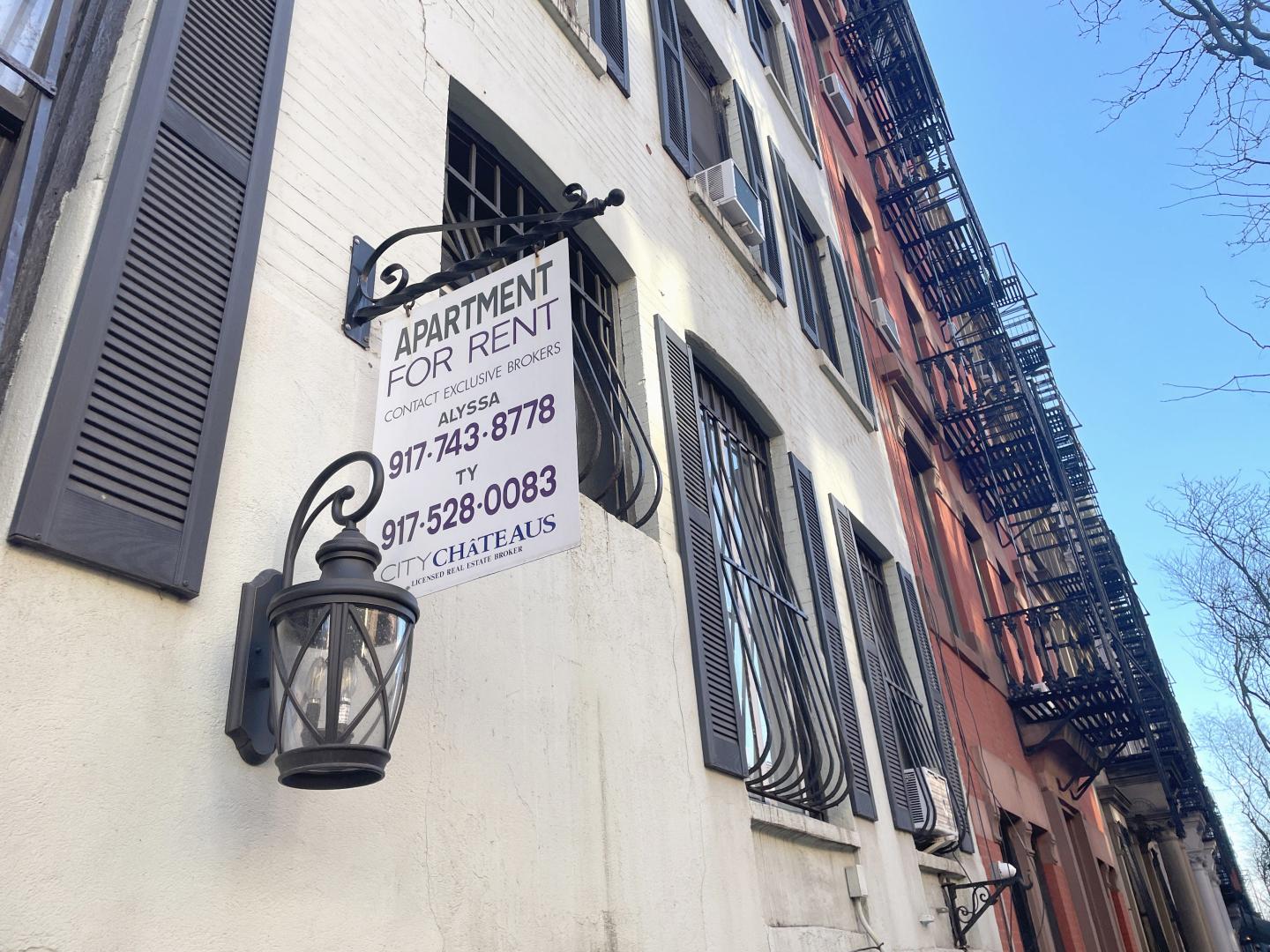 A 'For Rent' sign on a Hell's Kitchen, New York City apartment building