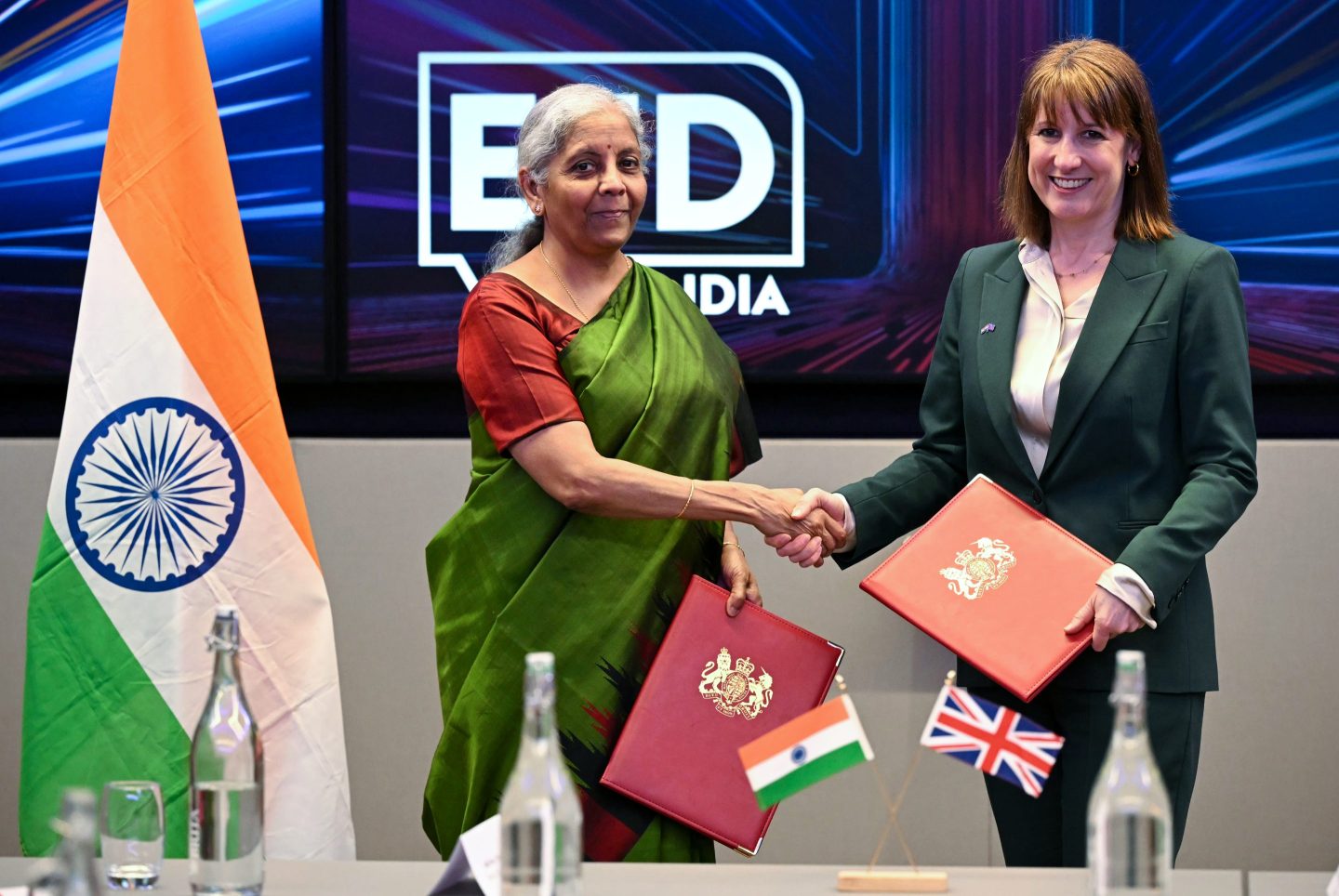 Britain's Chancellor of the Exchequer Rachel Reeves (R) shakes hands with her Indian counterpart, Finance Minister Nirmala Sitharaman at the London Stock Exchange Group (LSEG).