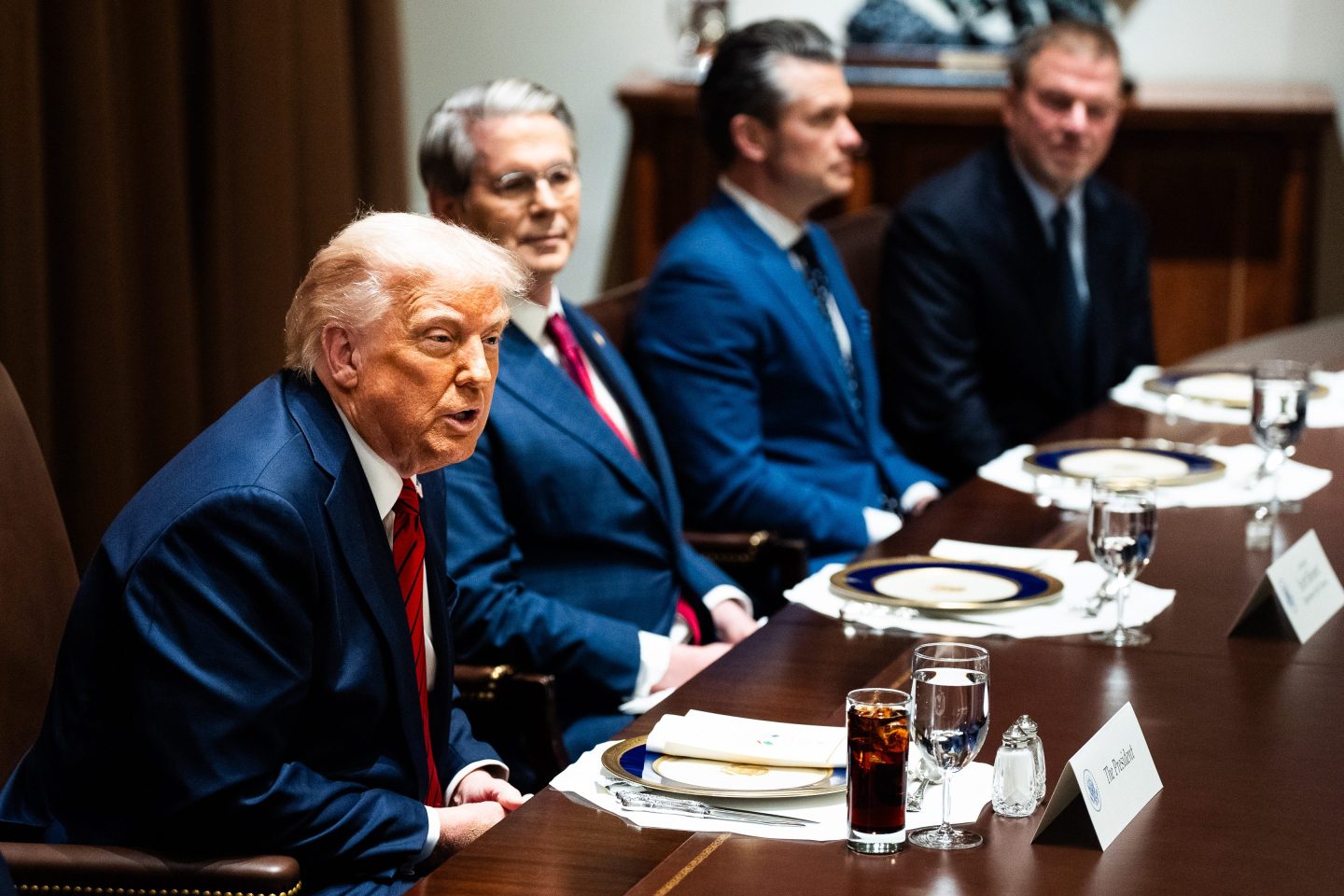President Donald Trump eats lunch with his cabinet and the Prime Minister of Italy in April.