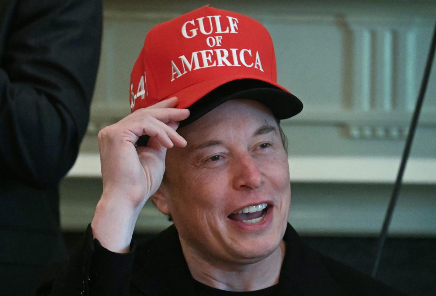 Elon Musk in a cap that reads "Gulf of America"