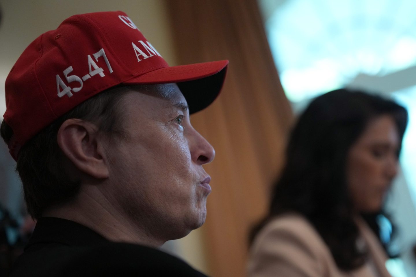 Elon Musk looks on during a Cabinet meeting at the White House on April 30.