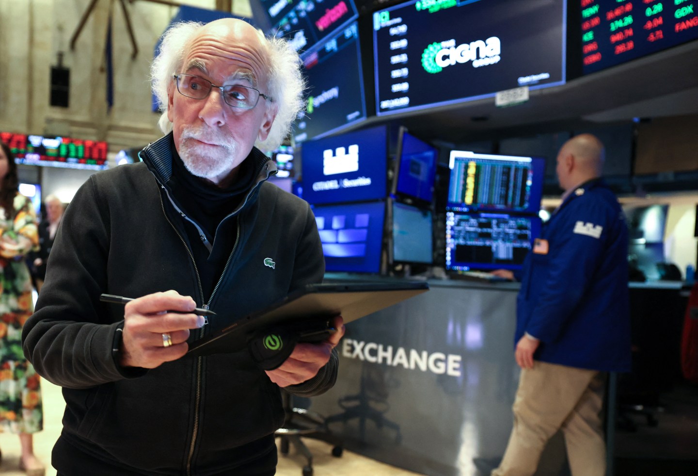 Traders work on the floor of the New York Stock Exchange at the opening bell in New York City. (Photo by TIMOTHY A. CLARY/AFP via Getty Images)