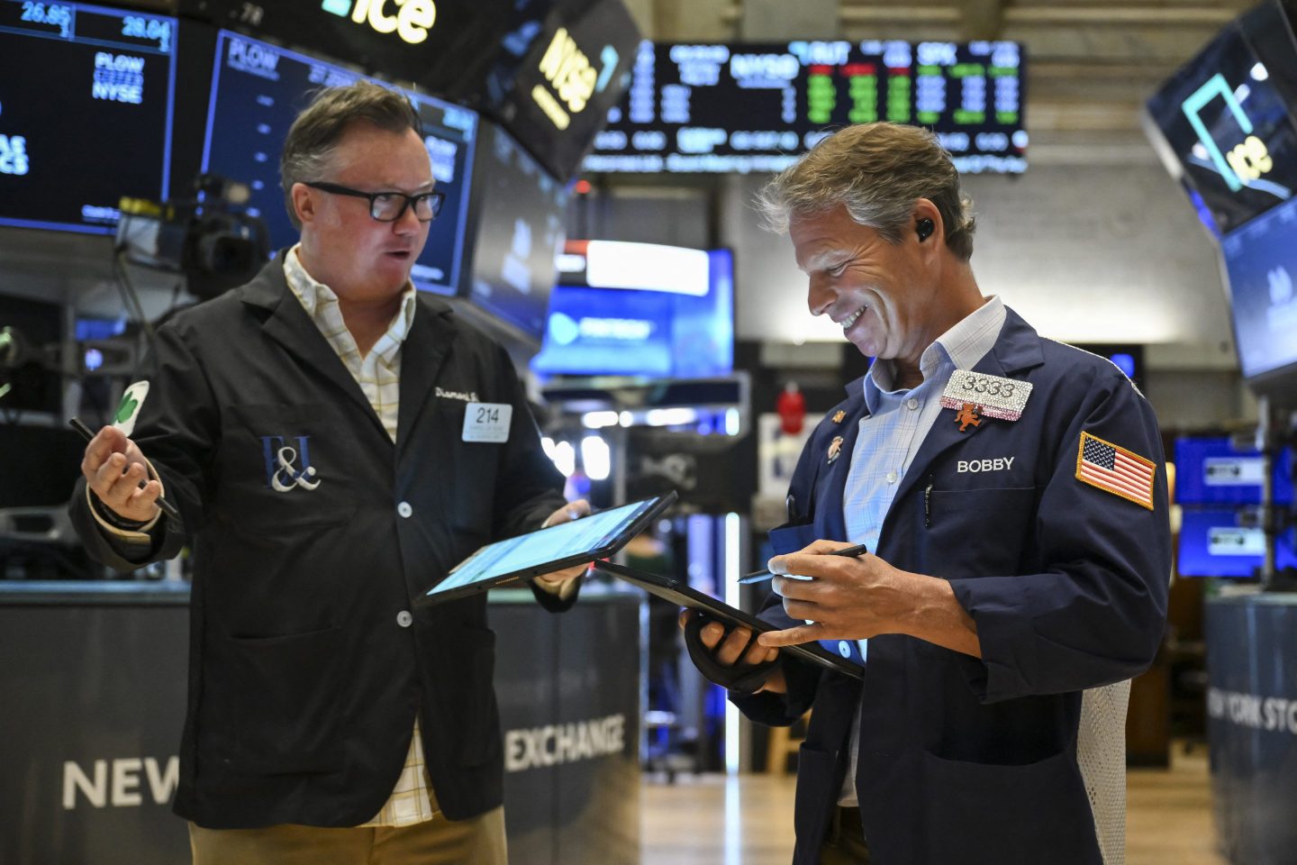 Traders work on the floor of the New York Stock Exchange at the opening bell on May 12.