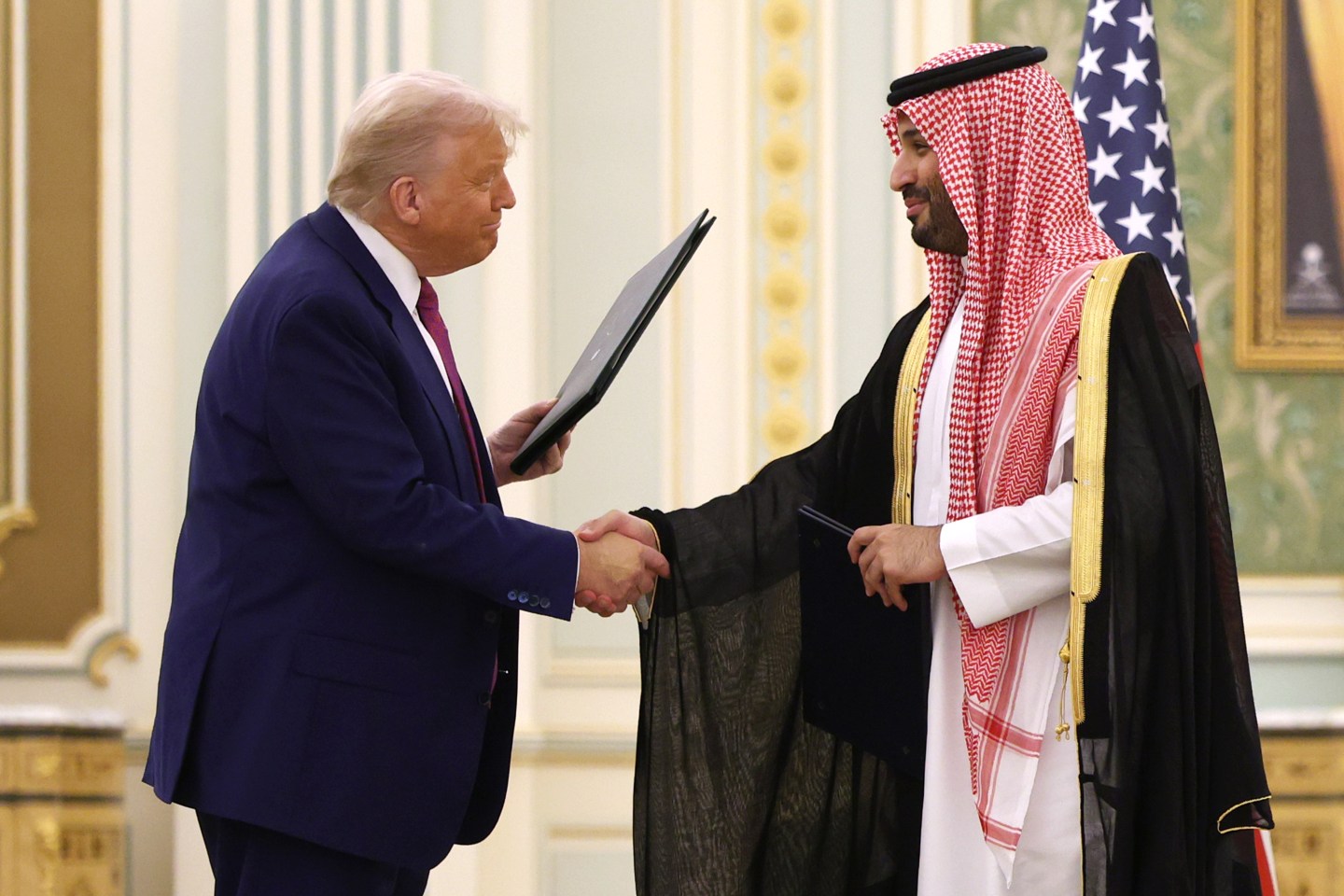 U.S. President Donald Trump shakes hands with Saudi Crown Prince Mohammed Bin Salman during Trump's visit to the Middle East.