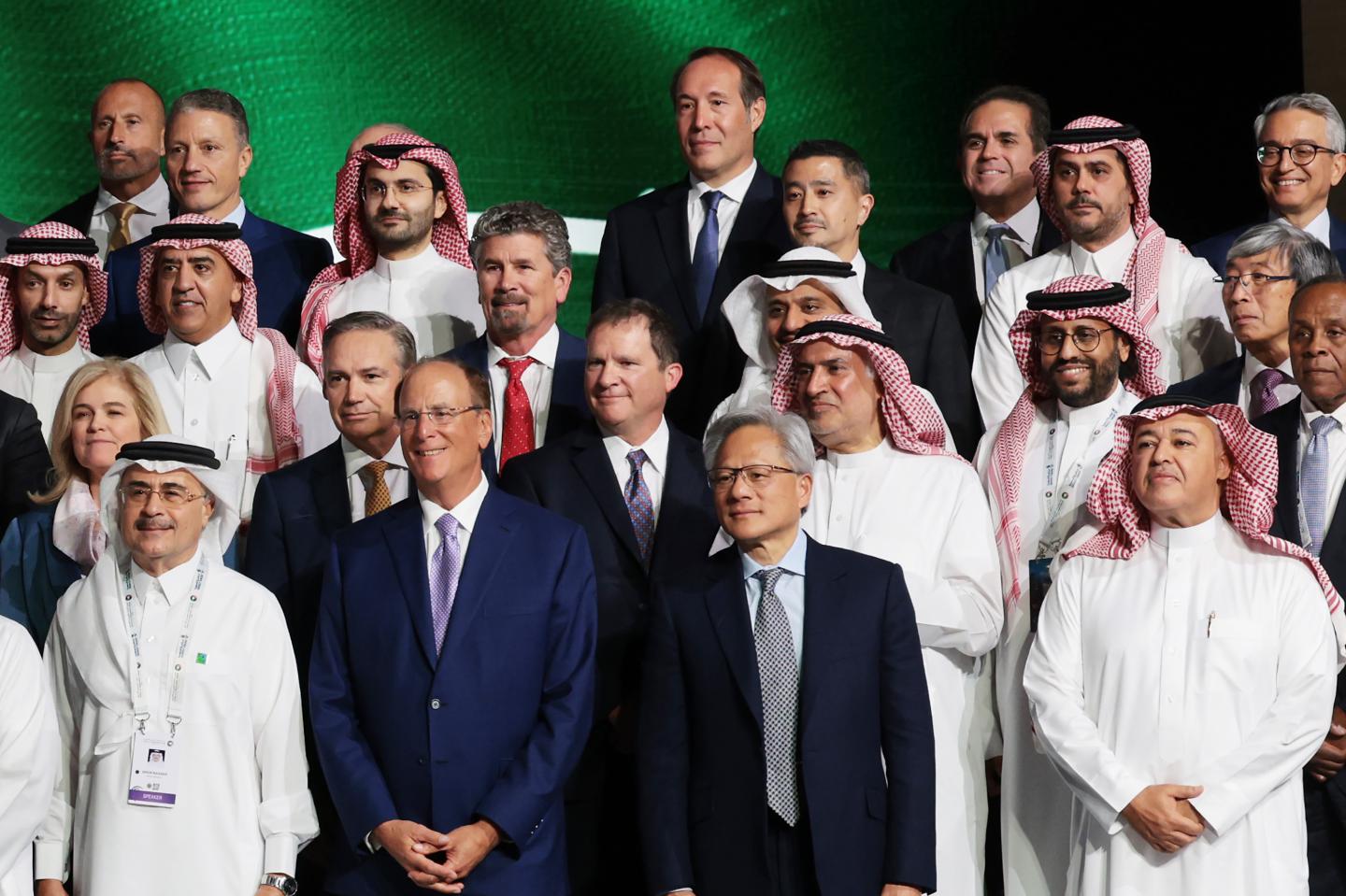 Nvidia CEO Jensen Huang (with gray tie) poses for a photo with business leaders during a Saudi-U.S. business investment forum on May 13, 2025, in Riyadh, Saudi Arabia. (Photo: Win McNamee/Getty Images)