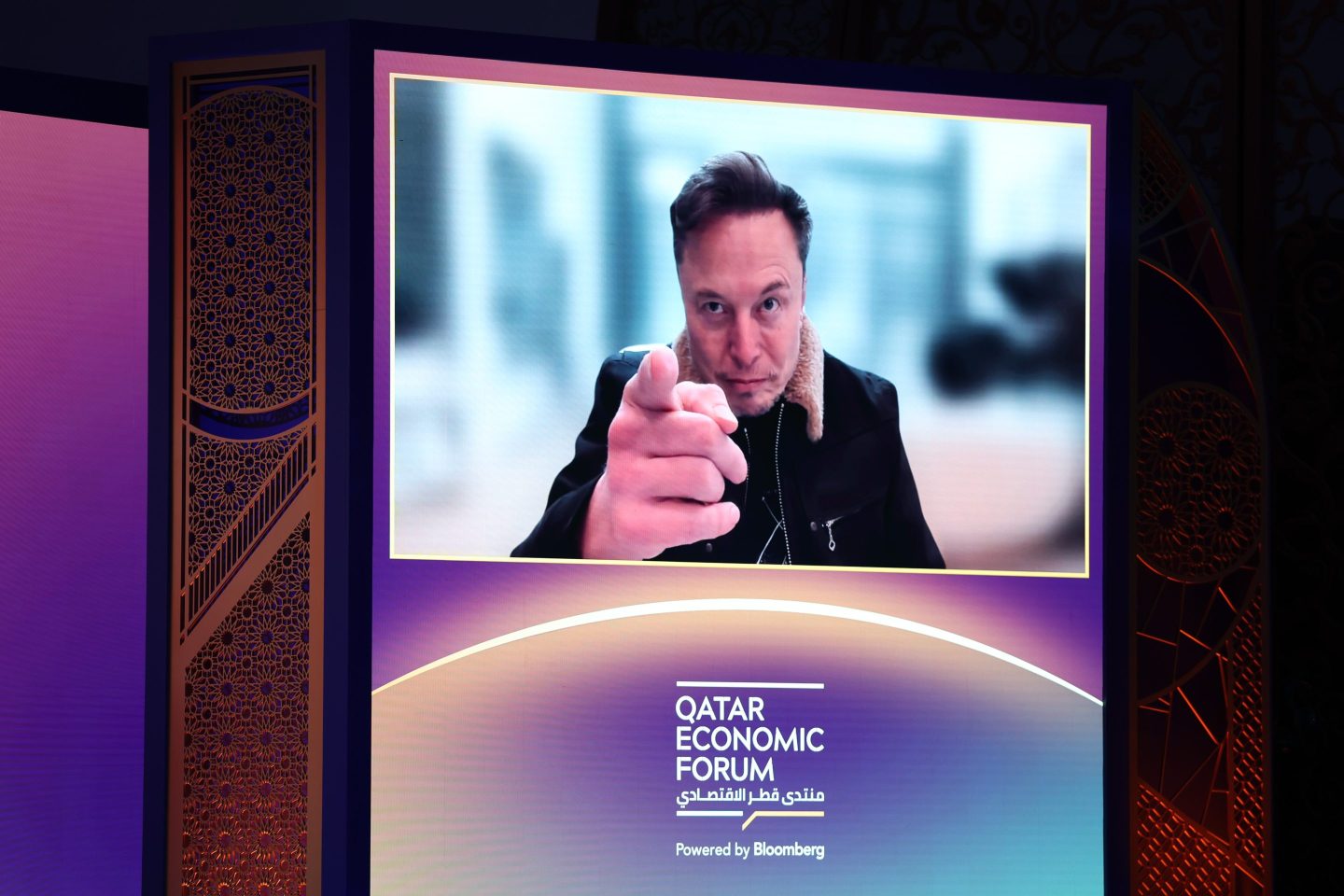 Elon Musk, chief executive officer of Tesla Inc., speaks via video link at the Qatar Economic Forum (QEF) in Doha, Qatar, on Tuesday