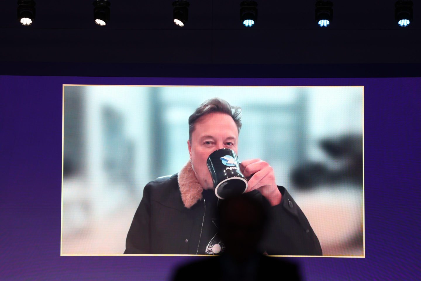 Elon Musk on a screen