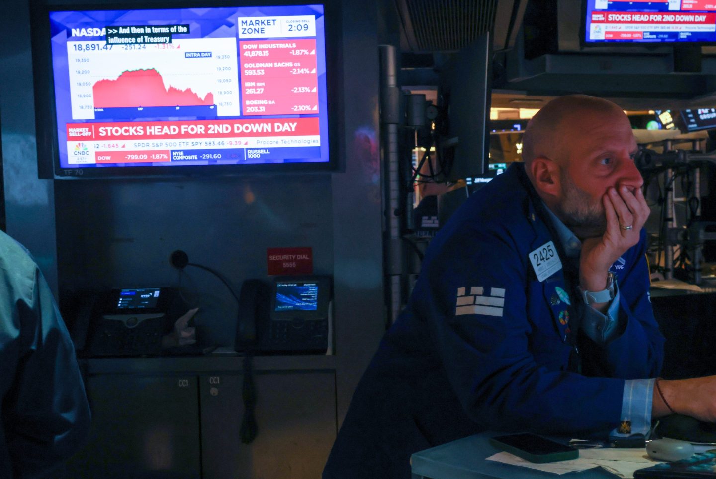 Traders work on the floor of the New York Stock Exchange (NYSE) on May 21, 2025 in New York City.