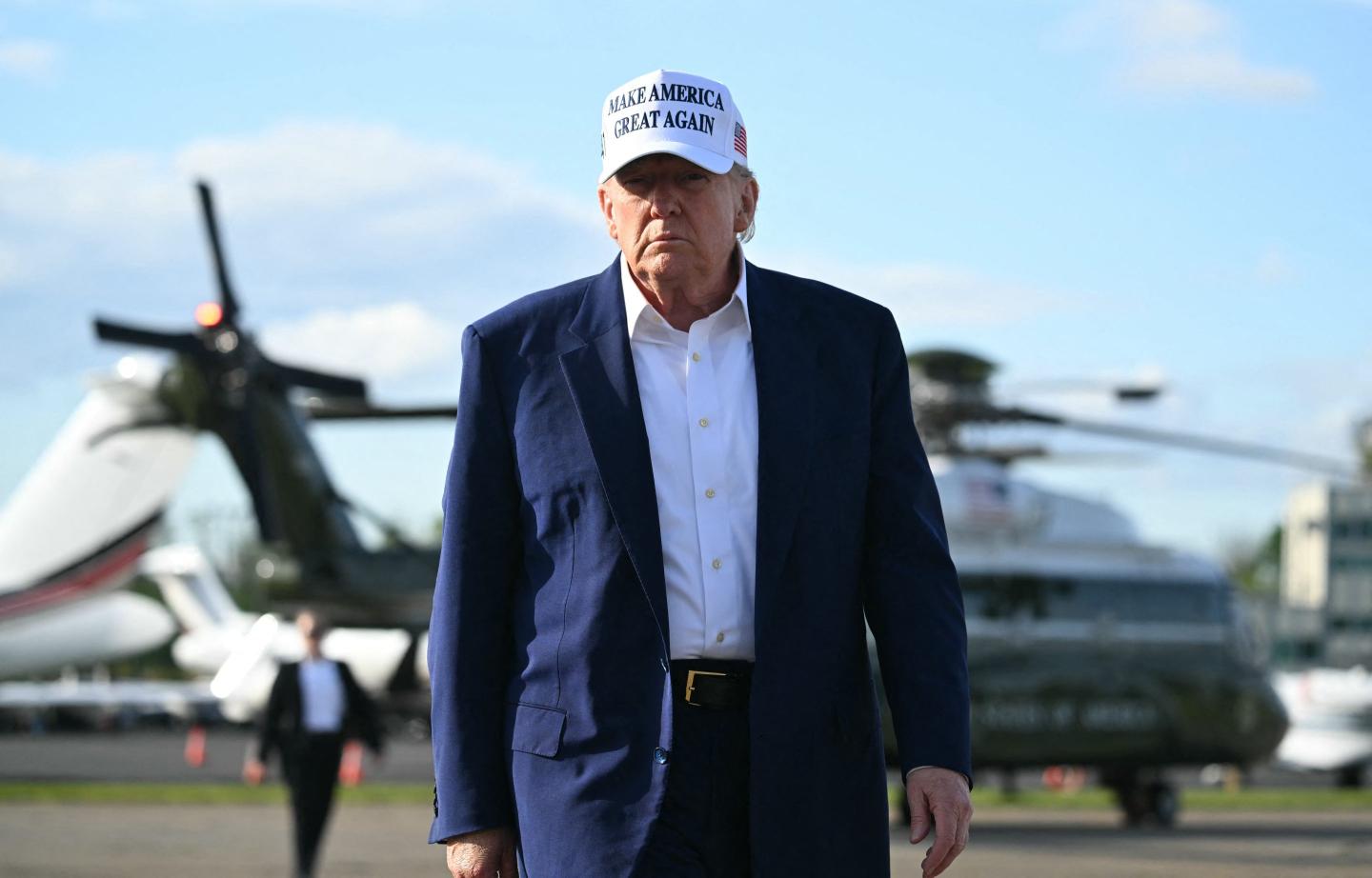 US President Donald Trump walks to speak to journalists before boarding Air Force One from Morristown Municipal Airport in Morristown, New Jersey, May 25, 2025