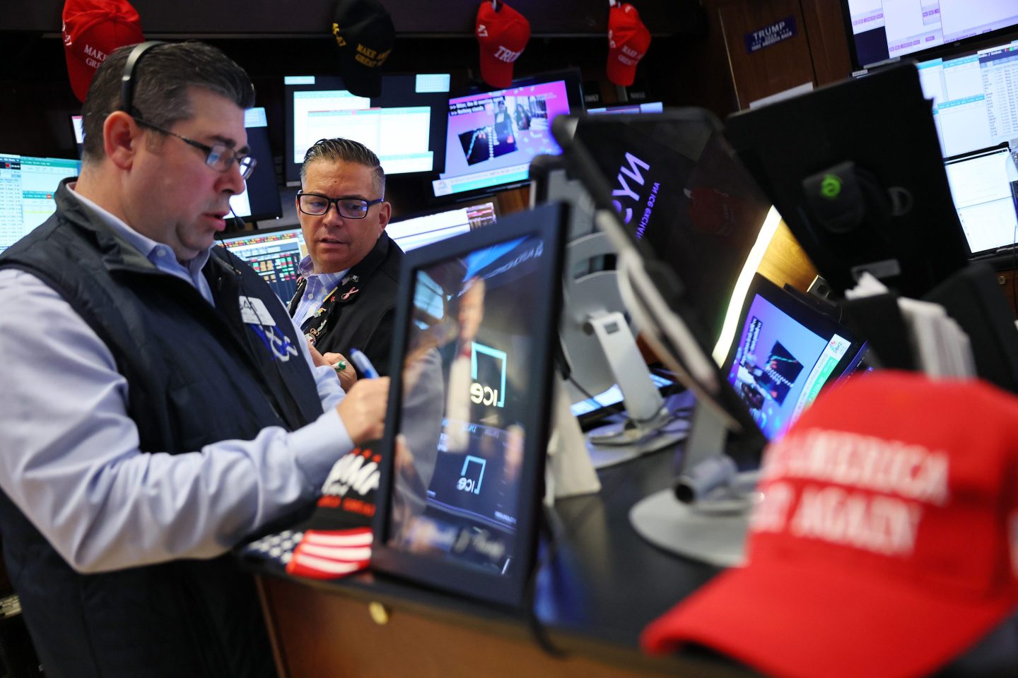 Traders work on the floor of the New York Stock Exchange during morning trading on May 27, 2025 in New York City.