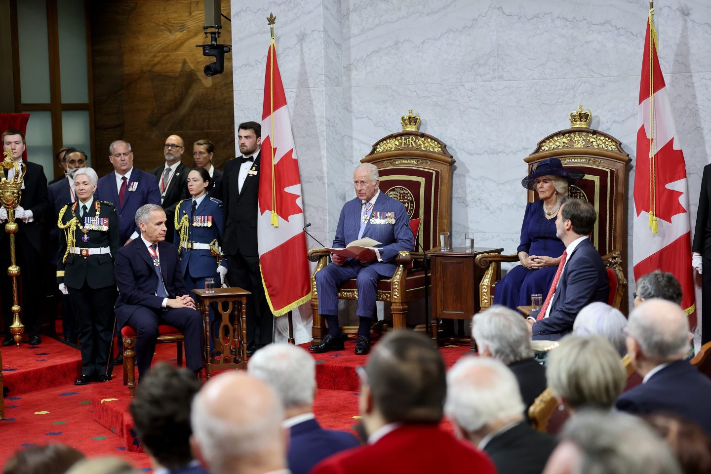 King Charles III and Queen Camilla in the Senate Chamber for the State Opening of Parliament during an official visit to Canada on May 27, 2025 in Ottawa, Ontario.