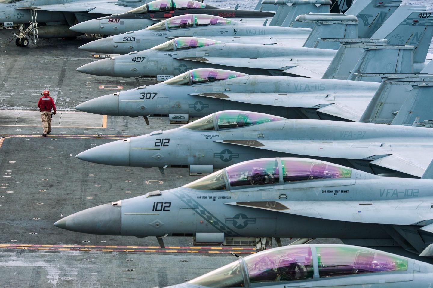 Fighter jets on a aircraft carrier