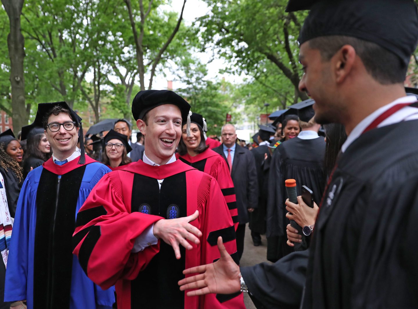Mark Zuckerberg wearing graduation regalia.