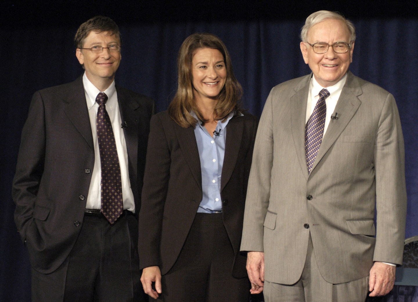 Bill and Melinda Gates alongside Warren Buffett in 2006.