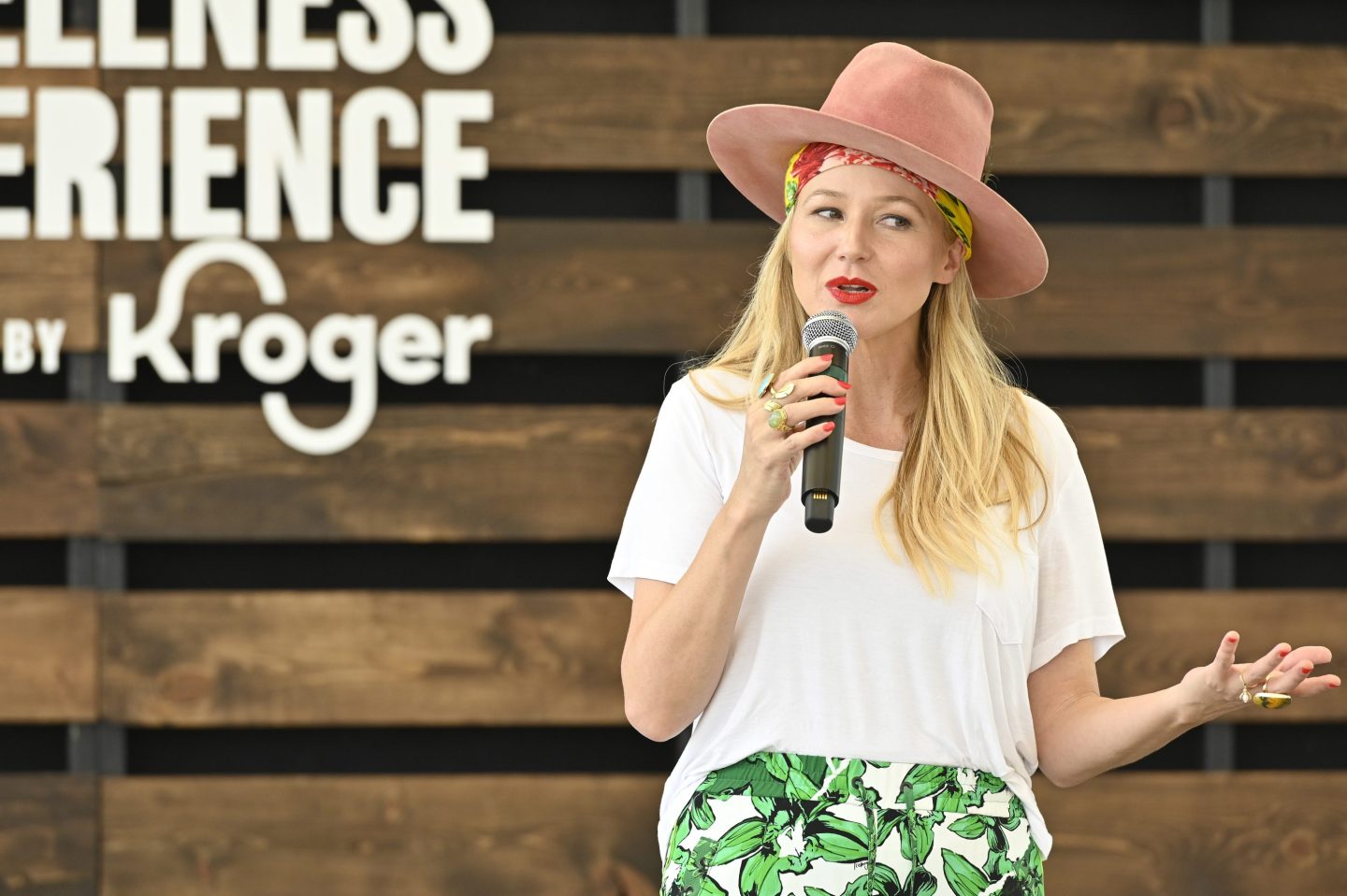Jewel in a hat on stage at the a wellness festival hosted by Kroger