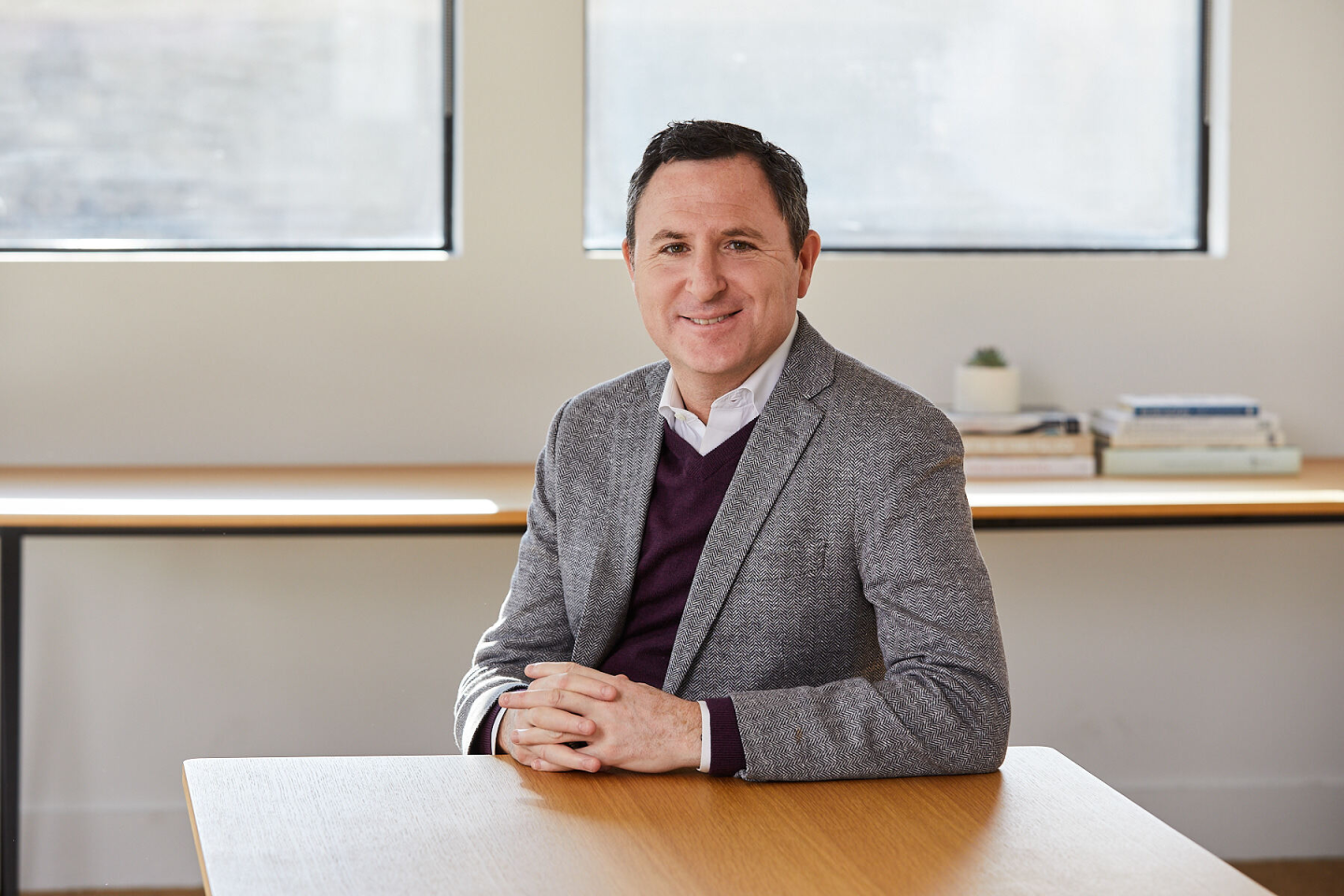 CEO of Greenhouse Daniel Chait sitting in an office.