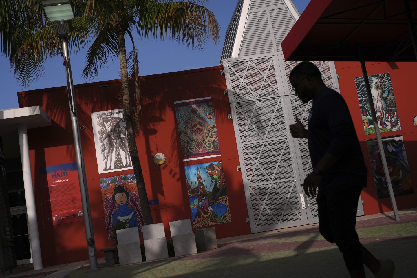 Haitian art is displayed on a wall outside the Little Haiti Cultural Complex in Miami on Friday.