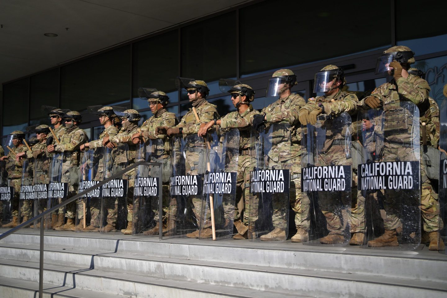 California National Guard stand in formation guarding the federal building in downtown Los Angeles on June 10, 2025.