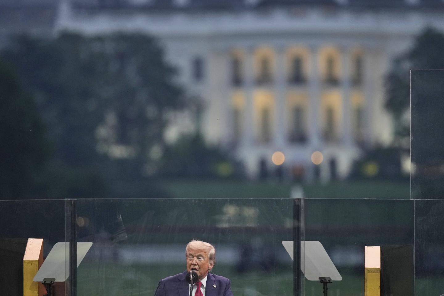 President Donald Trump speaks at a military parade commemorating the Army's 250th anniversary on June 14, 2025, in Washington.