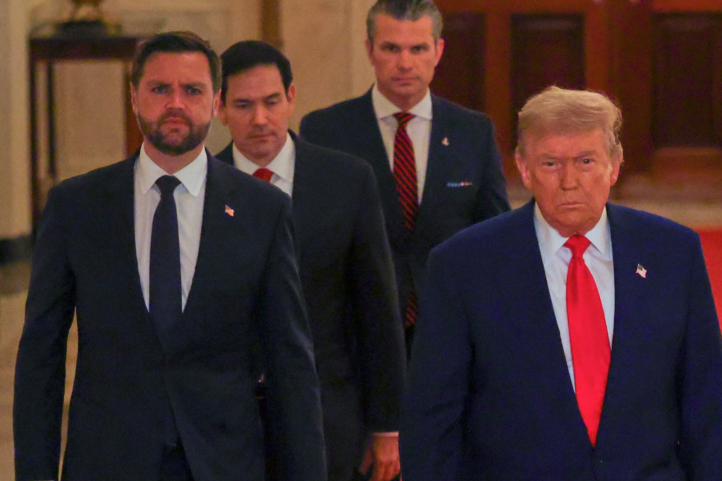 President Donald Trump arrives with Vice President JD Vance, Secretary of State Marco Rubio and Defense Secretary Pete Hegseth to speak from the East Room of the White House on Saturday