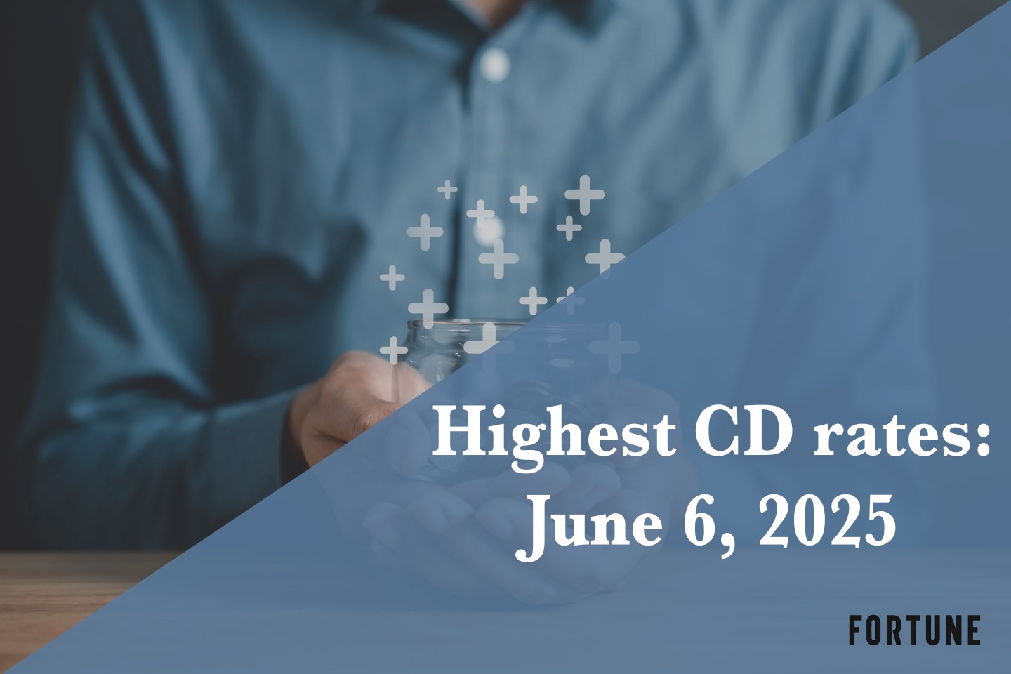 A person holding a jar full of coins.