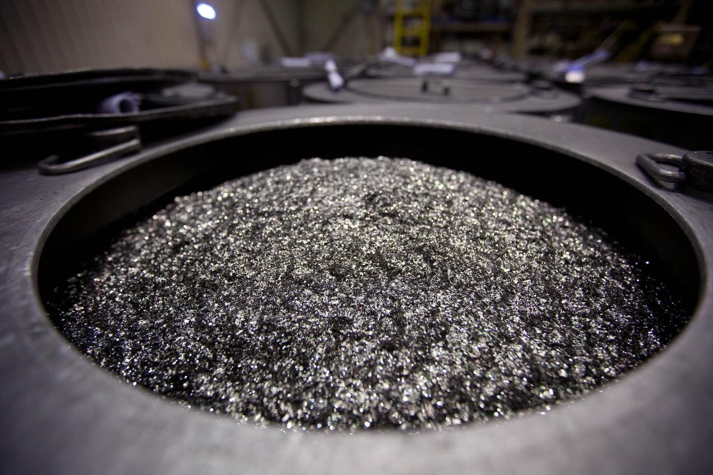 Annealed neodymium iron boron magnets sit in a barrel prior to being crushed into powder at Neo Material Technologies Inc.'s Magnequench Tianjin Co. factory in Tianjin, China, on Friday, June 11, 2010. 