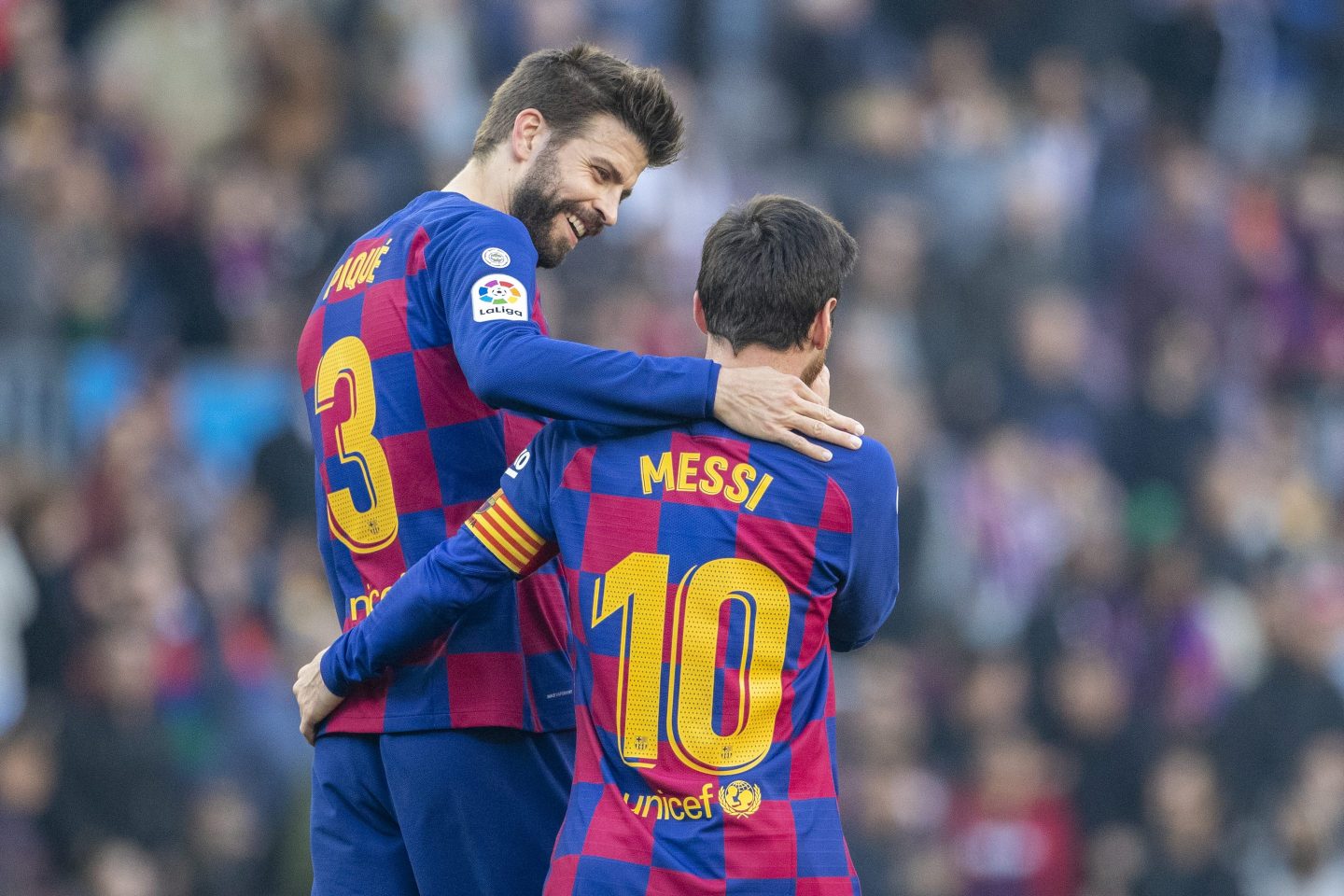 Lionel Messi #10 of Barcelona is congratulated by Gerard Pique #3 of Barcelona in 2020