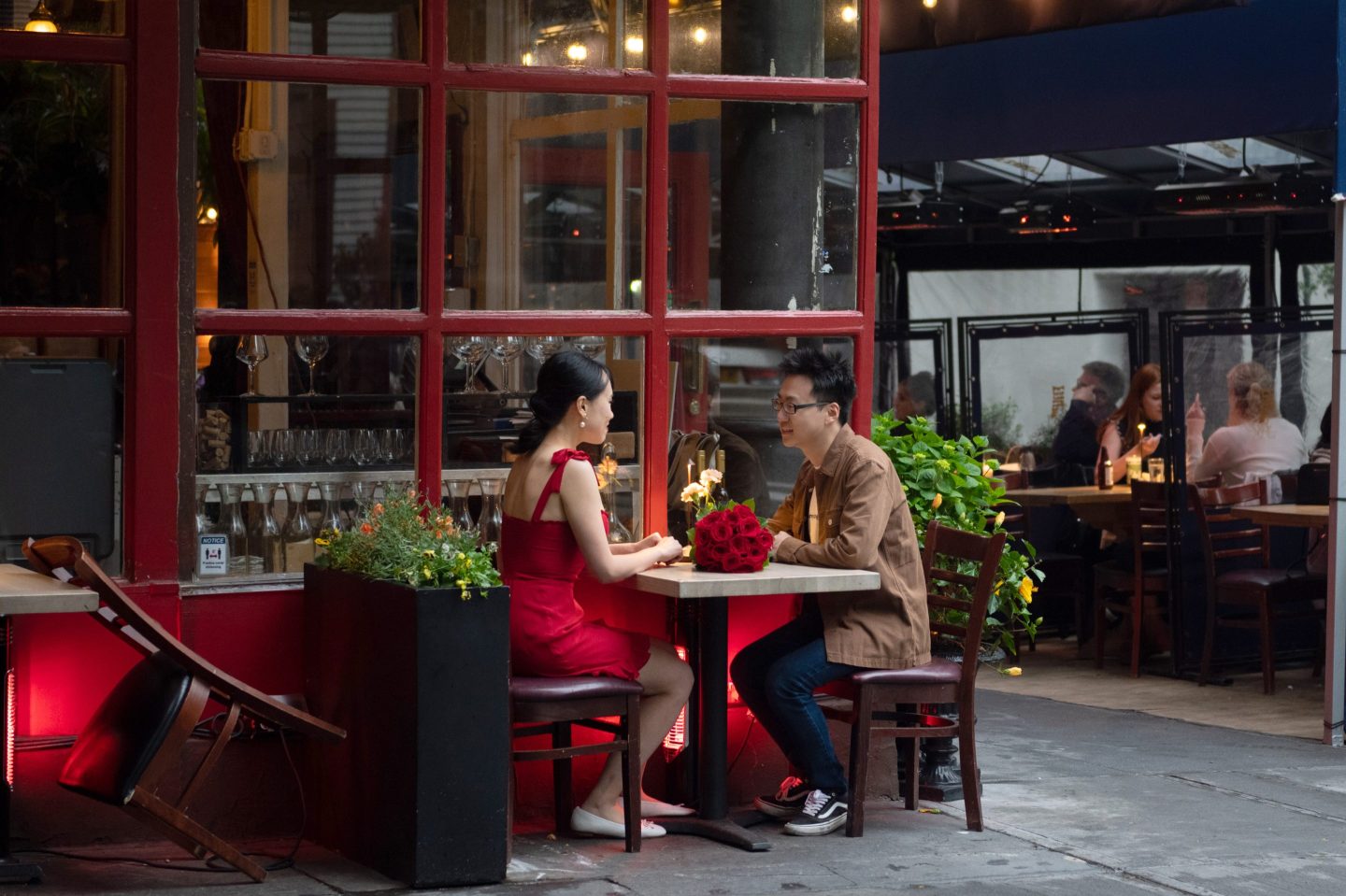 A couple sits at an outdoor restaurant on Memorial Day weekend on May 29, 2021 in New York City.