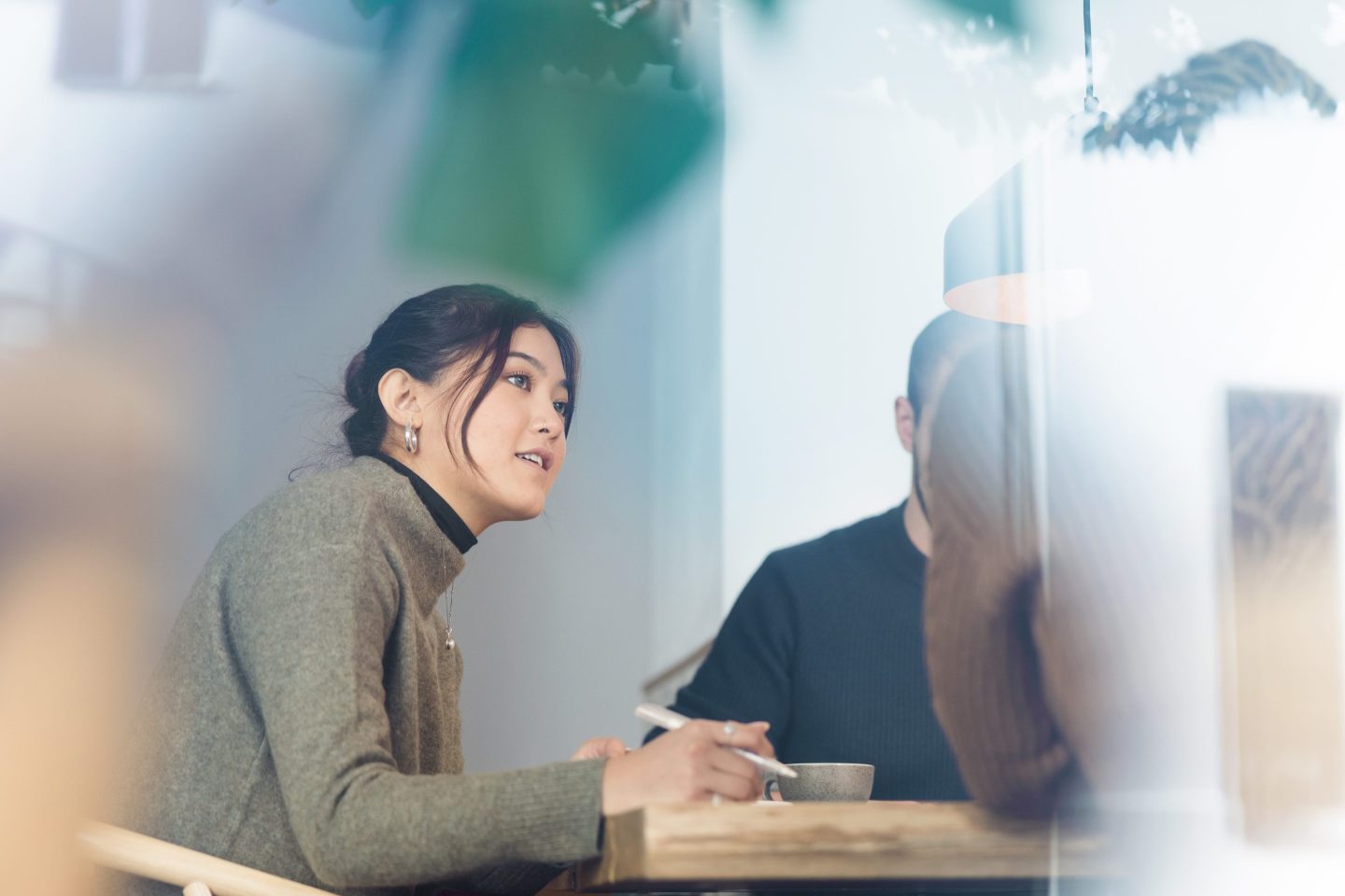 Employer interviewing a job applicant inside office boardroom