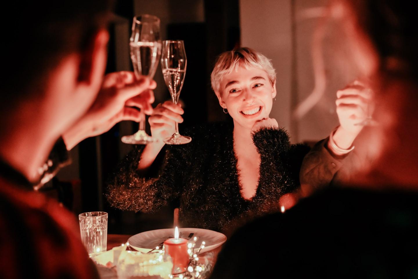 Young woman raising her champagne glass