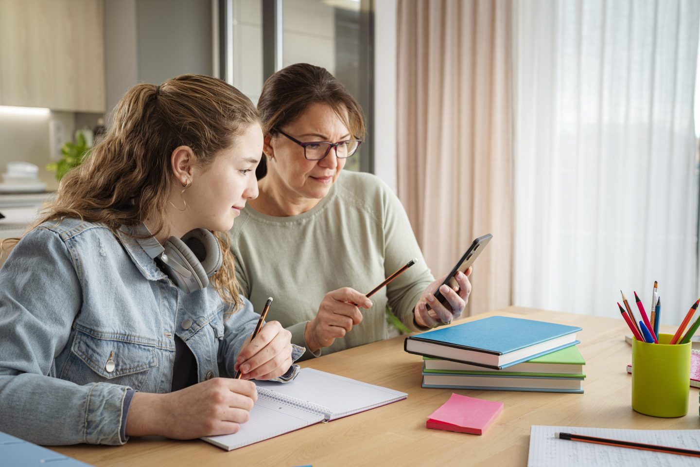 mother and daughter doing homework together