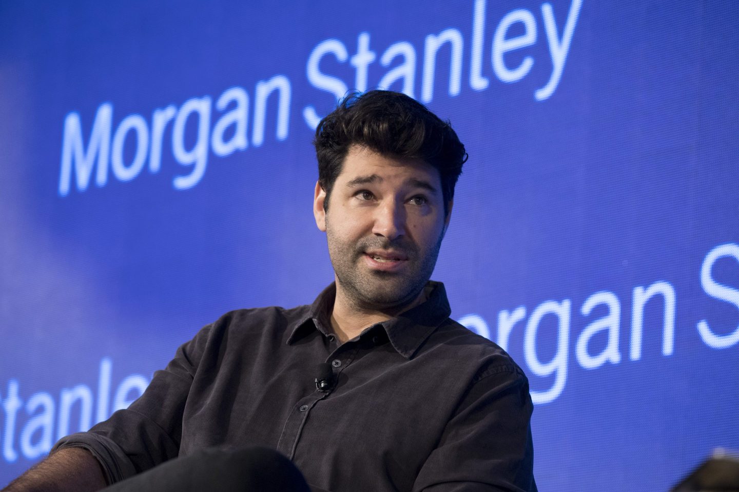 Cliff Obrecht on stage wearing a black shirt.