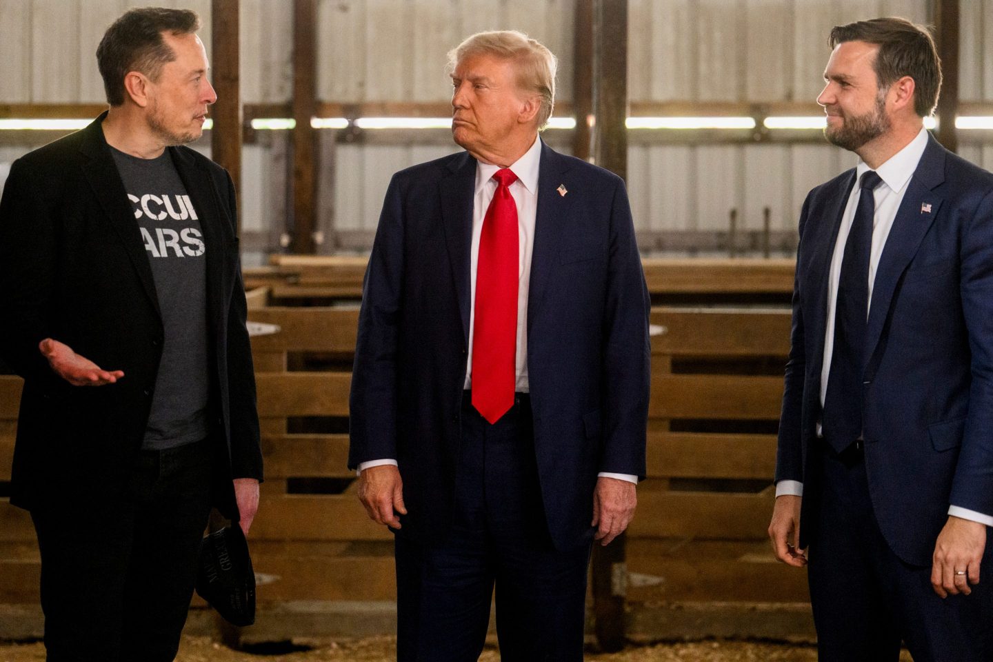 JD Vance (far right) says Elon Musk (far left) needs to “chill out” with his attacks on President Trump (center).