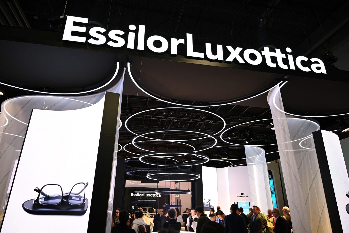 The EssilorLuxottica SA logo is displayed at the company's booth for the Nuance Audio OTC hearing aid glasses at the Consumer Electronics Show (CES) in Las Vegas, Nevada, on January 7, 2025