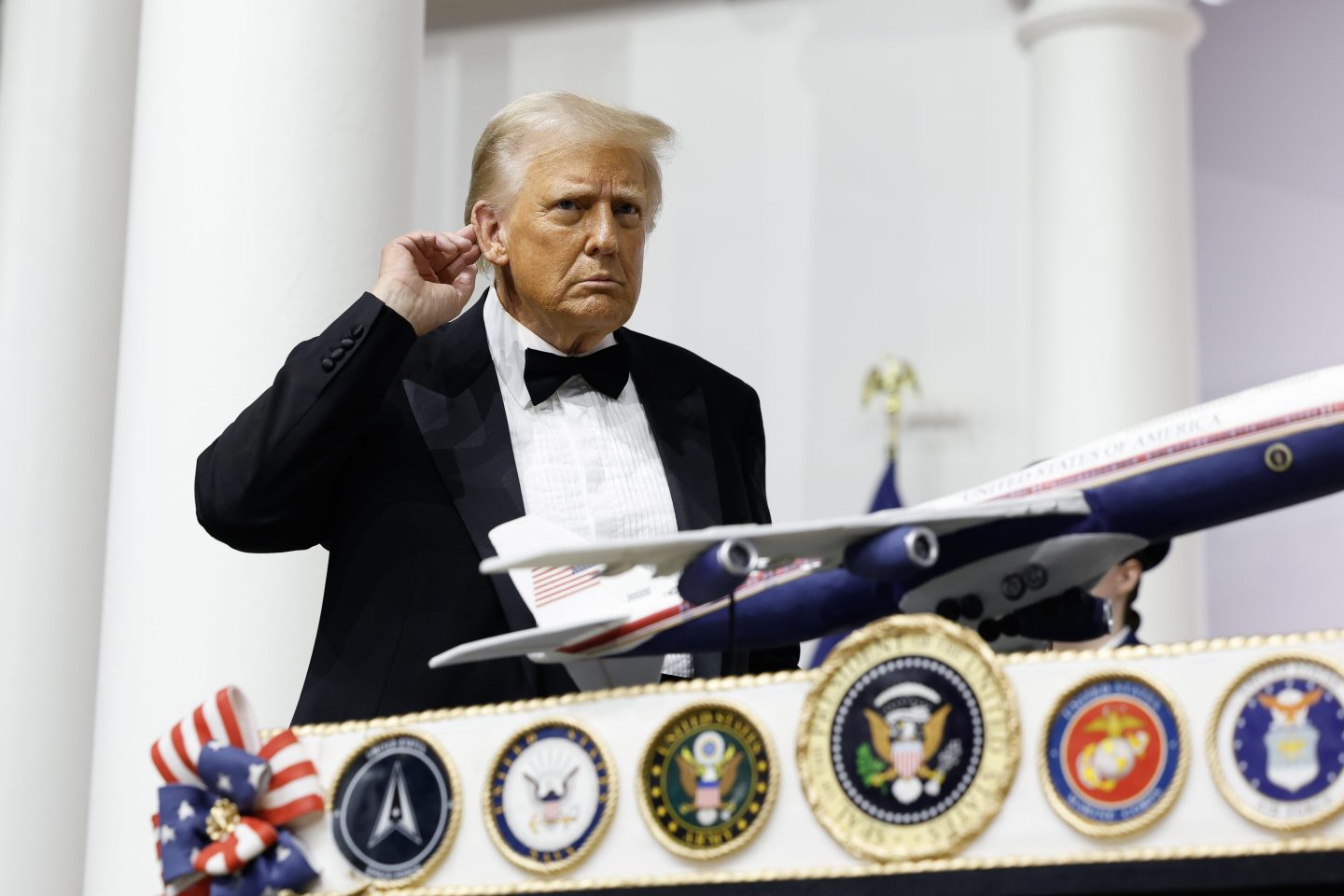 President Donald Trump cuts a cake at the Commander-in-Chief Ball on Jan. 20.