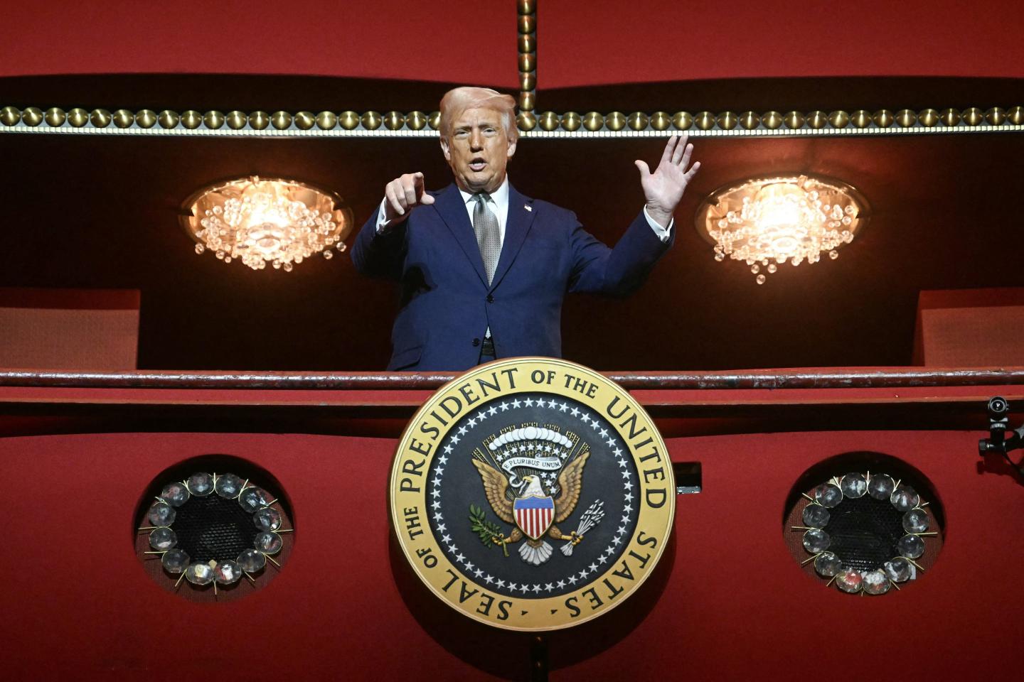 Trump waves from his box at the Kennedy Center