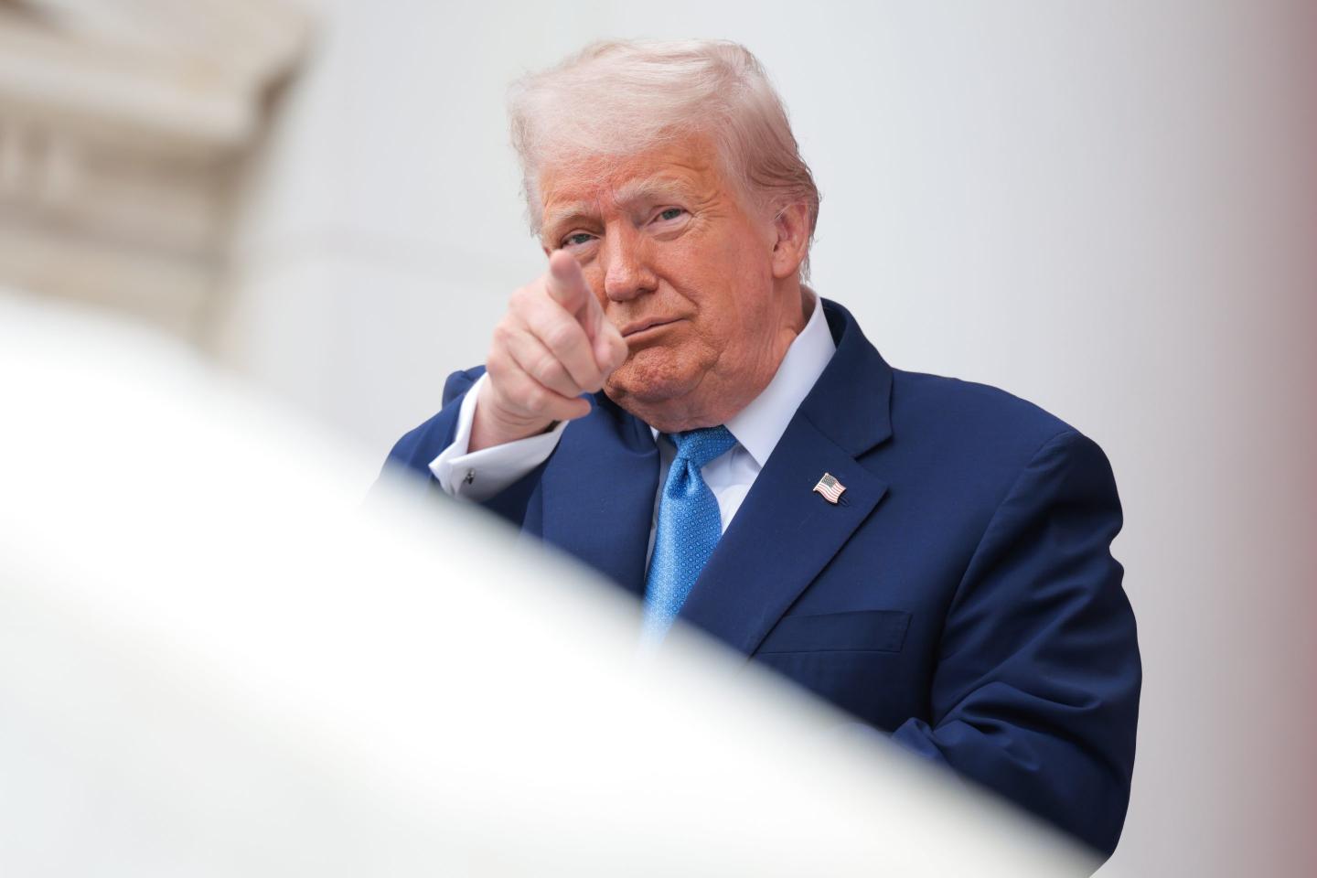 Trump points at the camera.
