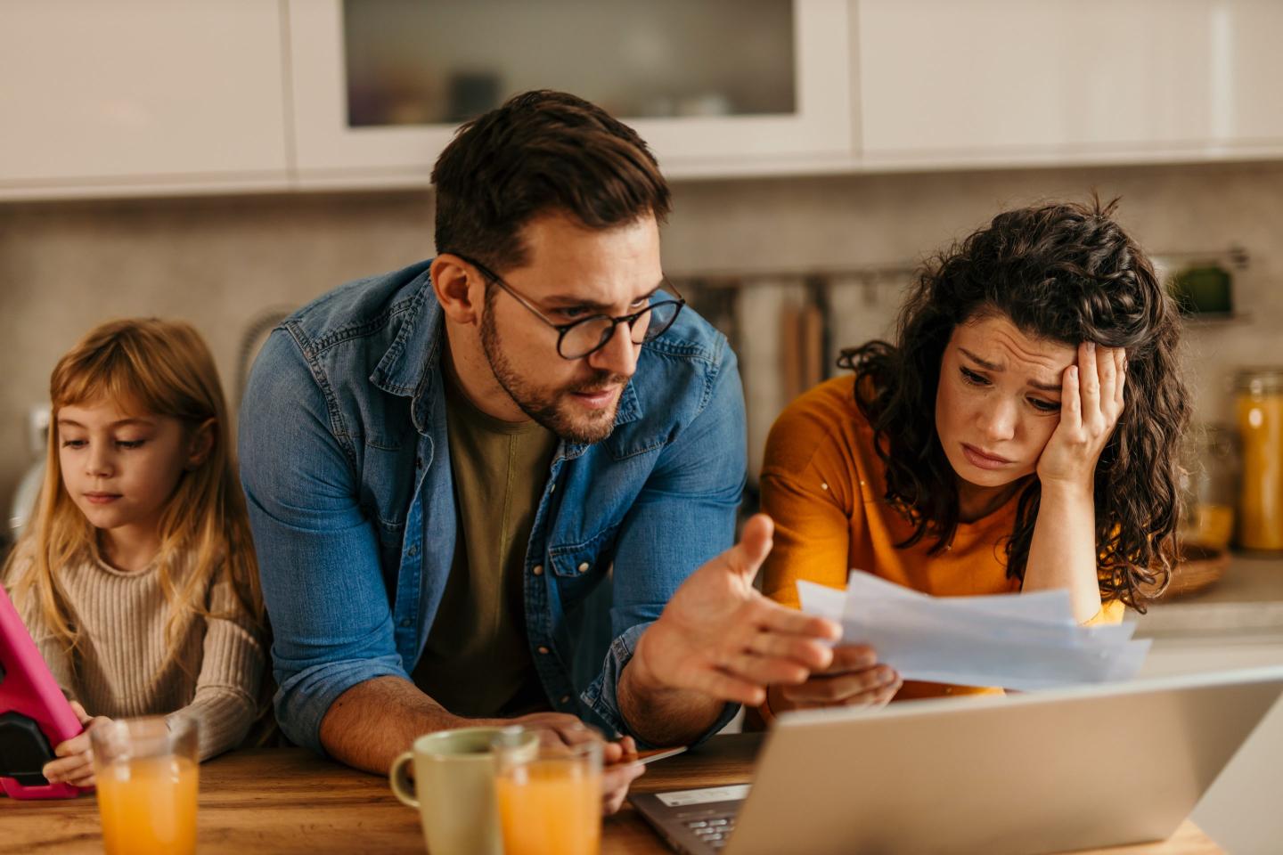 Photo of a man talking to a woman, who looks worried