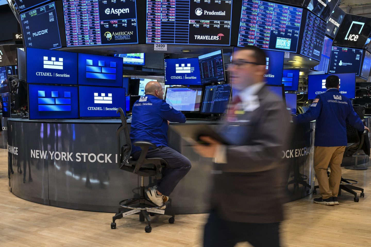 Traders work on the floor of the New York Stock Exchange (NYSE) at the opening bell on June 2, 2025, in New York City.