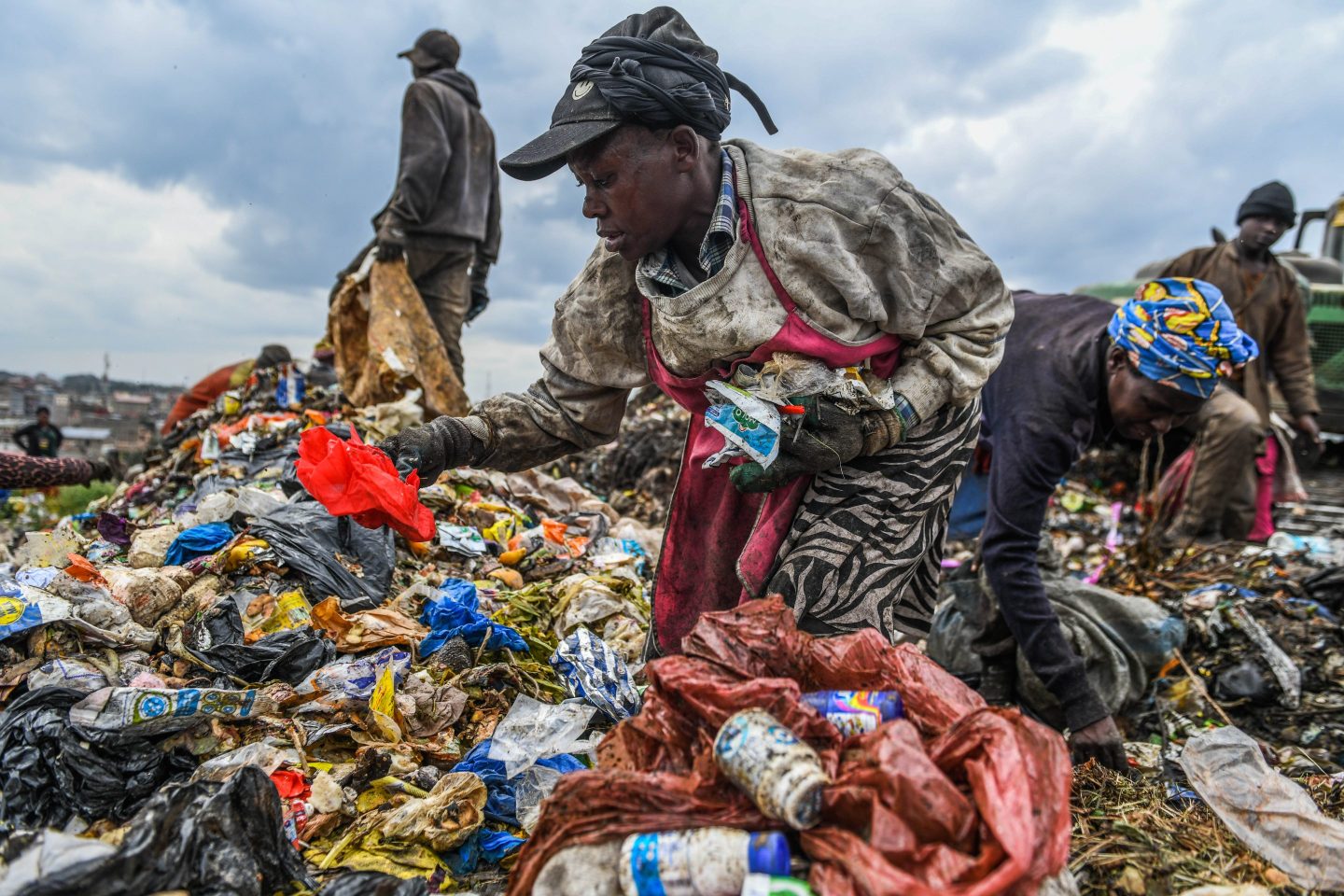 People search for recyclable materials among piles of waste at Dandora dumpsite in Nairobi, Kenya on June 4, 2025.