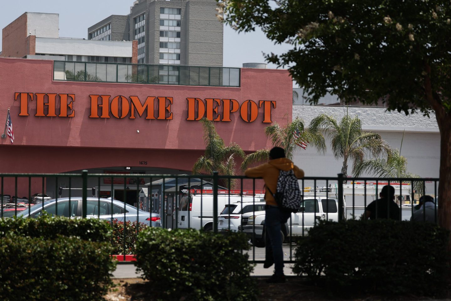 People wait outside of a Home Depot store on Wilshire Blvd that was previously the site of Immigration and Customs Enforcement (ICE) detention of day laborers in the Westlake MacArthur Park neighborhood of Los Angeles, California.