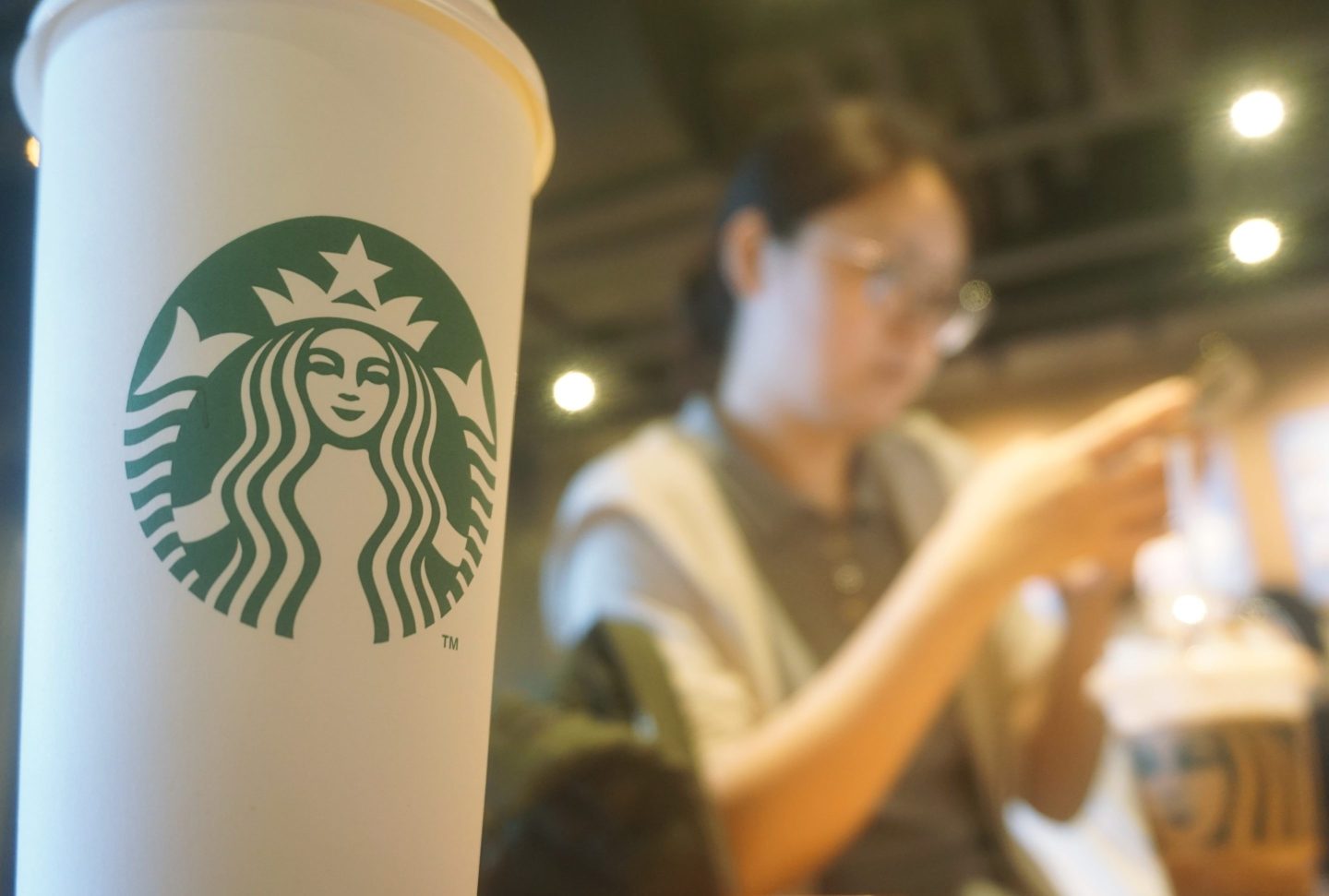 Starbucks logo is seen on a coffee cup inside the chain's coffee shop on June 9, 2025 in Hangzhou, Zhejiang Province of China.