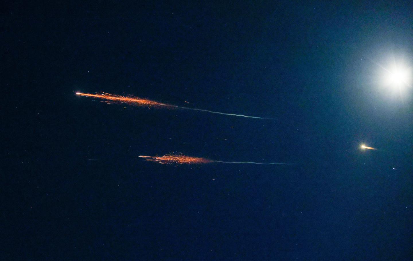 Israel’s “Iron Dome” air defense system responds to incoming Iranian ballistic missiles as seen from Tel Aviv on Sunday.